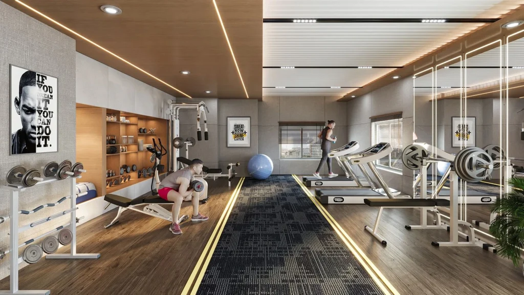 Well-equipped gymnasium at SM Surya Jyoti with cardio and strength training equipment