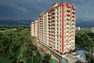 Side aerial view of Empire Exotica towers surrounded by greenery in Kahilipara Guwahati