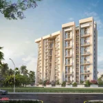 Daytime street view of Golden Woods Umang II residential tower with landscaped frontage in Guwahati