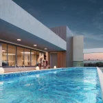 Rooftop swimming pool with lounge area at Golden Woods Umang II, Lokhra