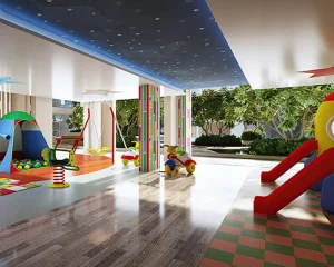 Indoor children’s play area with colorful slides, toys, and soft flooring in a well-lit, secure environment.